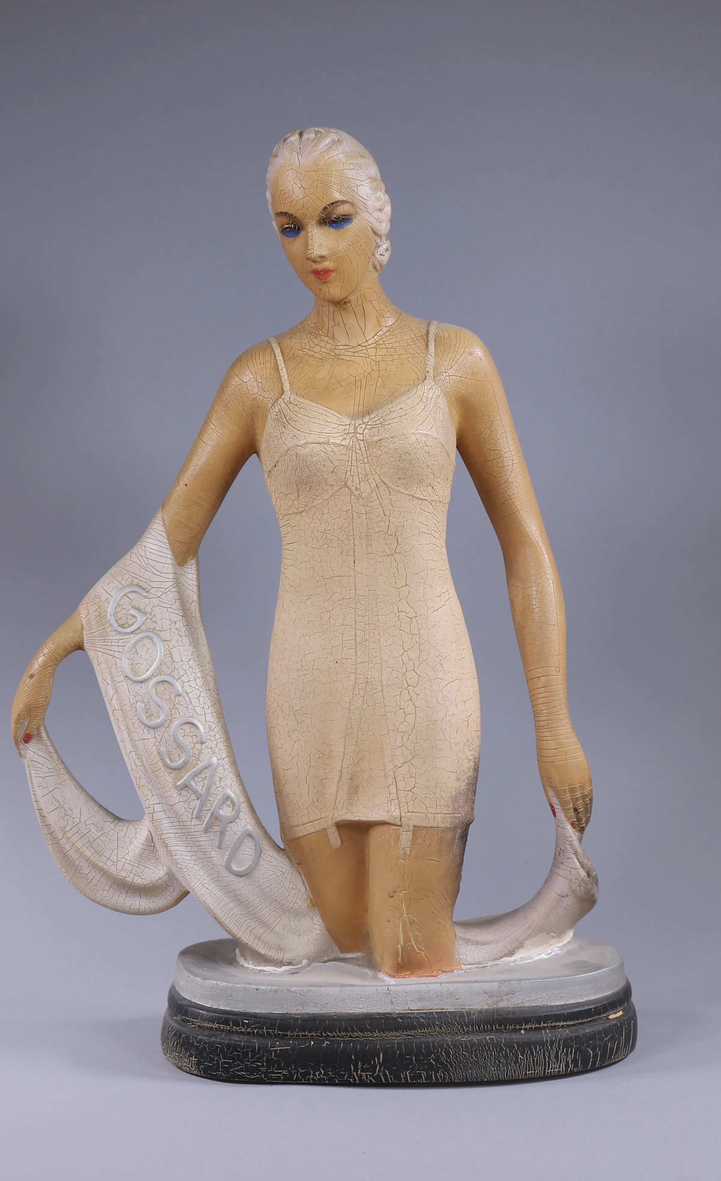 Art Deco-style figurine photographed as an estate sale collectible.